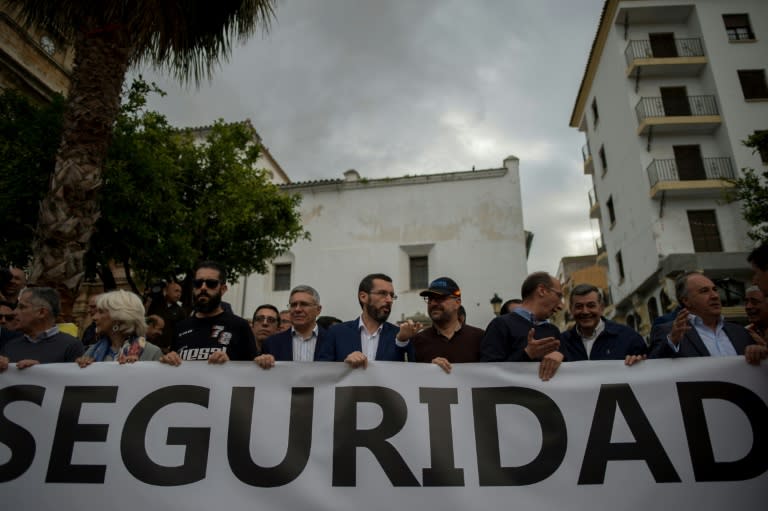 Protesters gathered in Algeciras' main square on Thursday hold a banner reading "security" as they rally against the violent drug trade