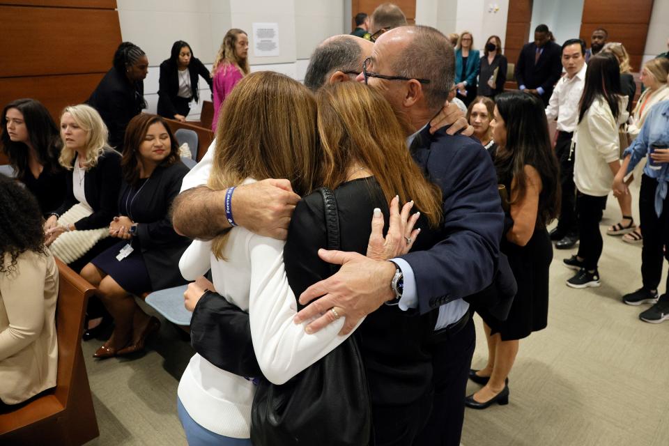 FORT LAUDERDALE, FLORIDA - OCTOBER 13: Linda Beigel Schulman, Michael Schulman, Patricia Padauy Oliver and Fred Guttenberg as families of the victims enter the courtroom for an expected verdict in the penalty phase of the trial of Marjory Stoneman Douglas High School shooter Nikolas Cruz at the Broward County Courthouse in Fort Lauderdale on Thursday, Oct. 13, 2022. Cruz, who plead guilty to 17 counts of premeditated murder in the 2018 shootings, is the most lethal mass shooter to stand trial in the U.S. He was previously sentenced to 17 consecutive life sentences without the possibility of parole for 17 additional counts of attempted murder for the students he injured that day. (Photo by Amy Beth Bennett-Pool/Getty Images)