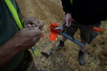 Army veterans and archeologists dig as part of archaeological research campaign called "Waterloo Uncovered" in Waterloo