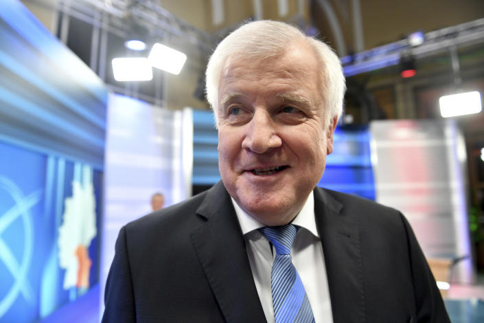 German Interior Minister Horst Seehofer leaves after a TV interview after the Bavaria state election in Munich, Germany, Sunday, Oct. 14, 2018. (Lukas Barth-Tuttas/pool photo via AP)