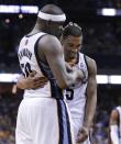 Memphis Grizzlies forward Zach Randolph (50) congratulates Courtney Lee after Lee sank a free throw in the final seconds of the Grizzlies' 98-95 overtime win against the Oklahoma City Thunder in Game 3 of an opening-round NBA basketball playoff series Thursday, April 24, 2014, in Memphis, Tenn. (AP Photo/Mark Humphrey)