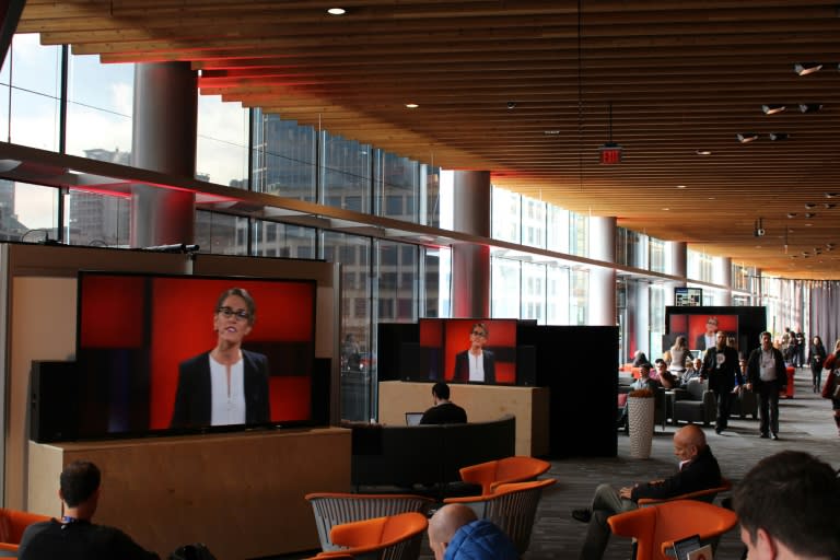 TED attendees watch live streams of talks at the prestigious conference, from social areas outside the main theater, in Vancouver, on February 16, 2016