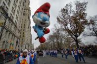 The Papa Smurf balloon floats down Central Park West during the 88th Macy's Thanksgiving Day Parade in New York November 27, 2014. REUTERS/Eduardo Munoz (UNITED STATES - Tags: SOCIETY)