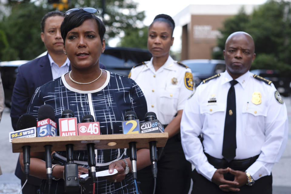 Atlanta Mayor Keisha Lance Bottoms said two officers were "ambushed" while responding to a report of a shooting in a building in the city's Midtown area in Atlanta, Wednesday, June 30, 2021. At right is Atlanta Police Chief Rodney Bryant. The officers returned fire, killing one suspect, police said. (Ben Gray/Atlanta Journal-Constitution via AP)