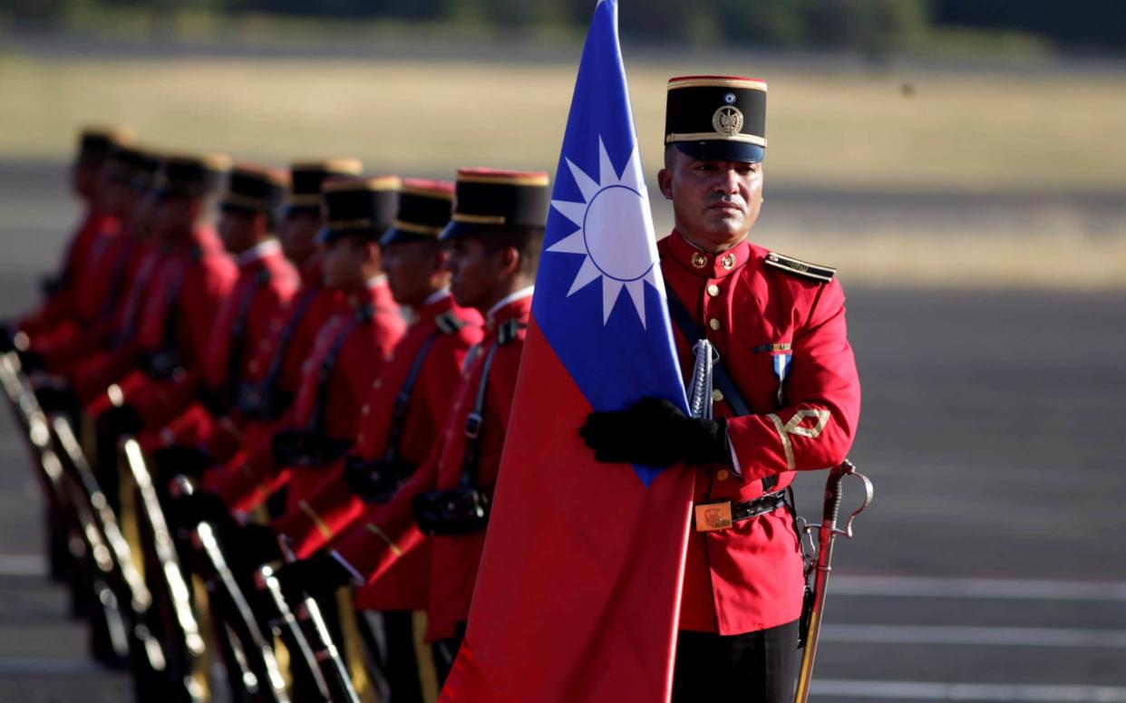 El Salvador last year held an honour guard for the Taiwanese president but now it has severed ties with her government - REUTERS