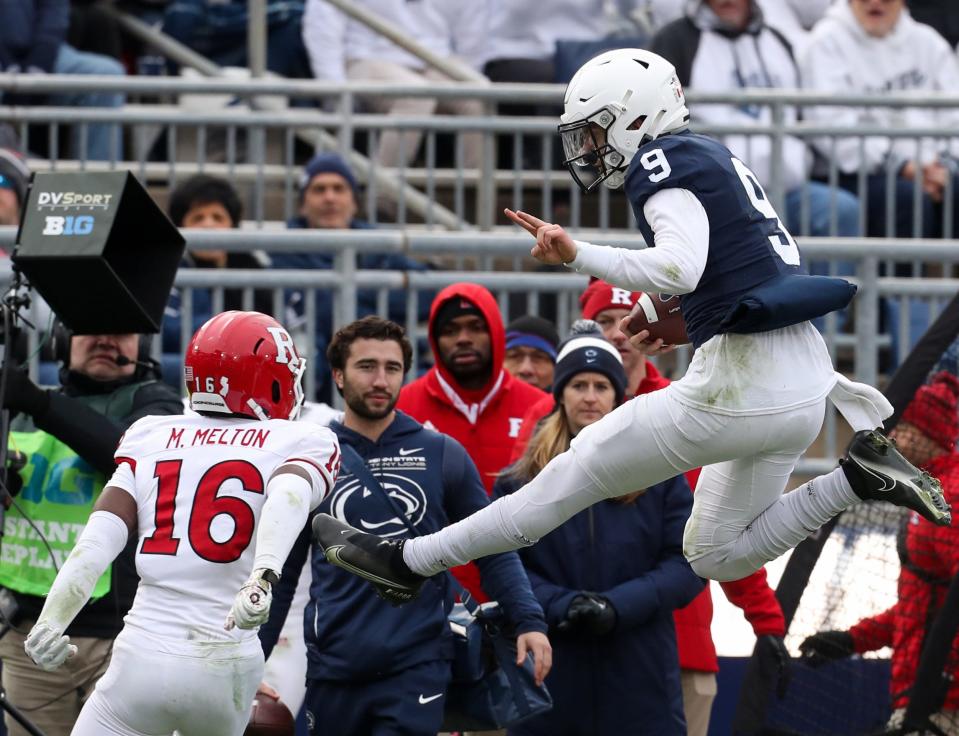 Nov 20, 2021; University Park, Pennsylvania, USA; Penn State Nittany Lions quarterback Christian Veilleux (9) leaps into the air to avoid a tackle during the fourth quarter against the Rutgers Scarlet Knights at Beaver Stadium. Penn State defeated Rutgers 28-0. Mandatory Credit: Matthew OHaren-USA TODAY Sports