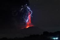 Volcanic lightnings and lava spew from the Calbuco volcano on April 23, 2015, as seen from Frutillar, Chile