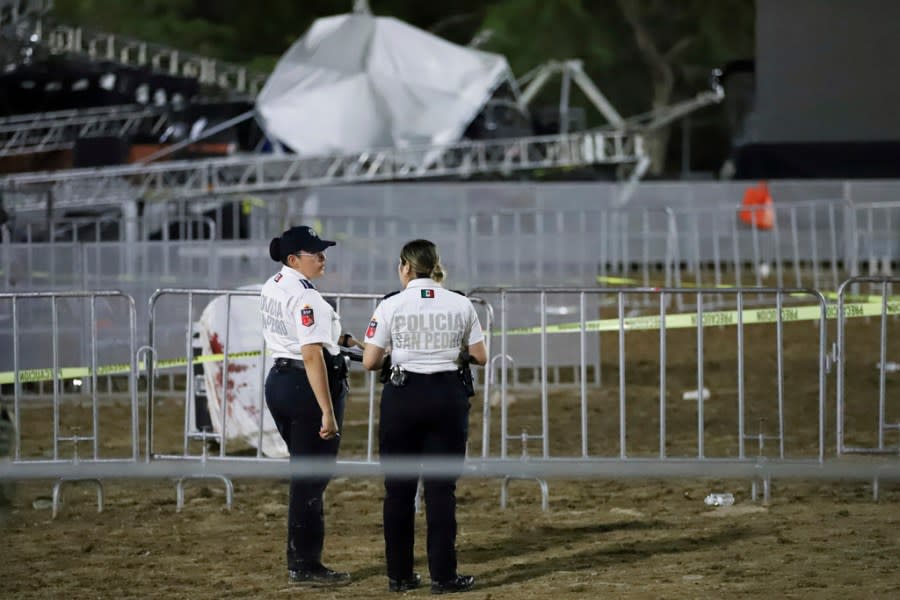 Security forces stand around a stage that collapsed due to a gust of wind during an event attended by presidential candidate Jorge Álvarez Máynez in San Pedro Garza García, on the outskirts of Monterey, Mexico, Wednesday, May 22, 2024. President Andres Manuel Lopez Obrador confirmed that four people were killed and at least a dozen were injured. (AP Photo/Alberto Lopez)