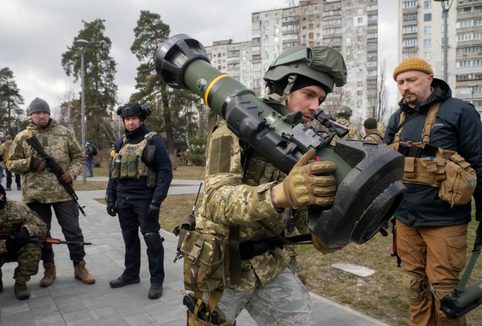 A Ukrainian Territorial Defence Forces member holds an NLAW anti-tank weapon, in the outskirts of Kyiv, Ukraine, Wednesday, March 9, 2022.