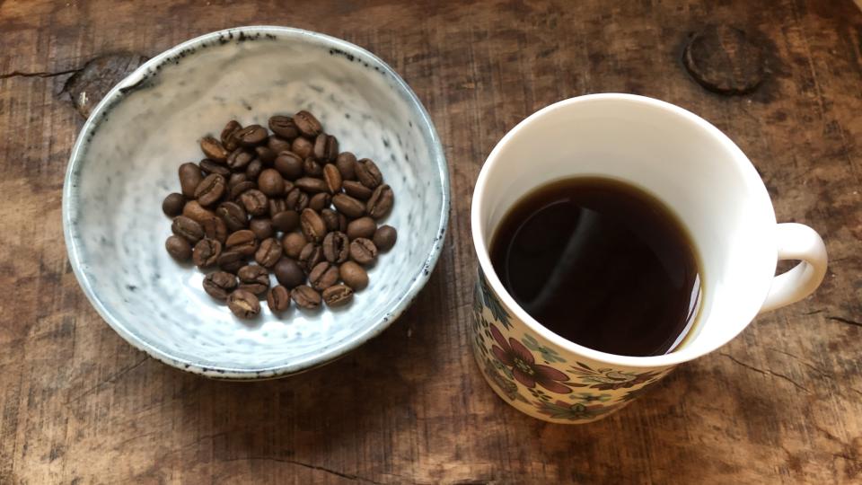 espresso and coffee beans on table