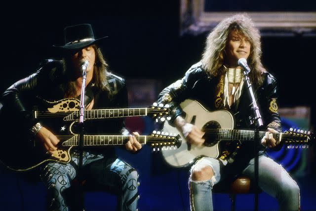 <p>Michael Ochs Archives/Getty </p> Jon Bon Jovi and Richie Sambora performing together in 1989