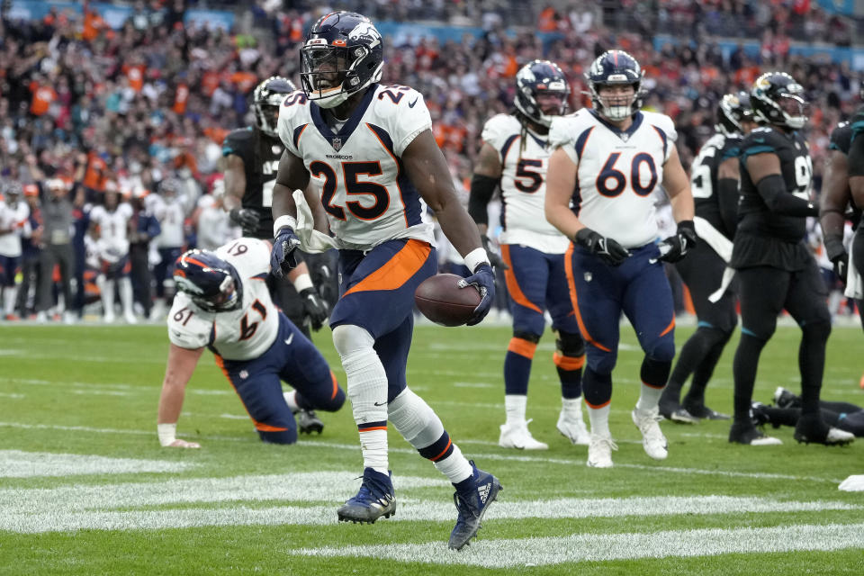 Denver Broncos running back Melvin Gordon III (25) celebrates a touchdown during the NFL football game between Denver Broncos and Jacksonville Jaguars at Wembley Stadium London, Sunday, Oct. 30, 2022. (AP Photo/Kirsty Wigglesworth)