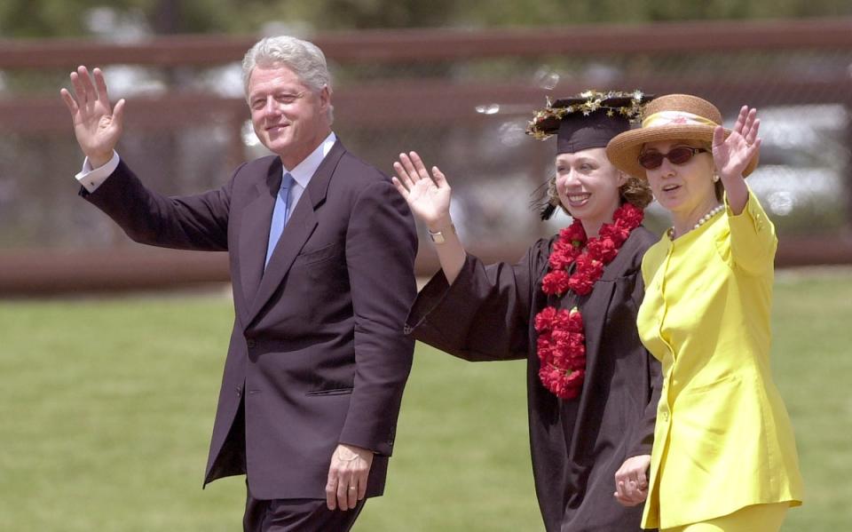 Bill, Chelsea and Hillary Clinton leave Stanford University's 2001 graduation ceremony (Getty Images)