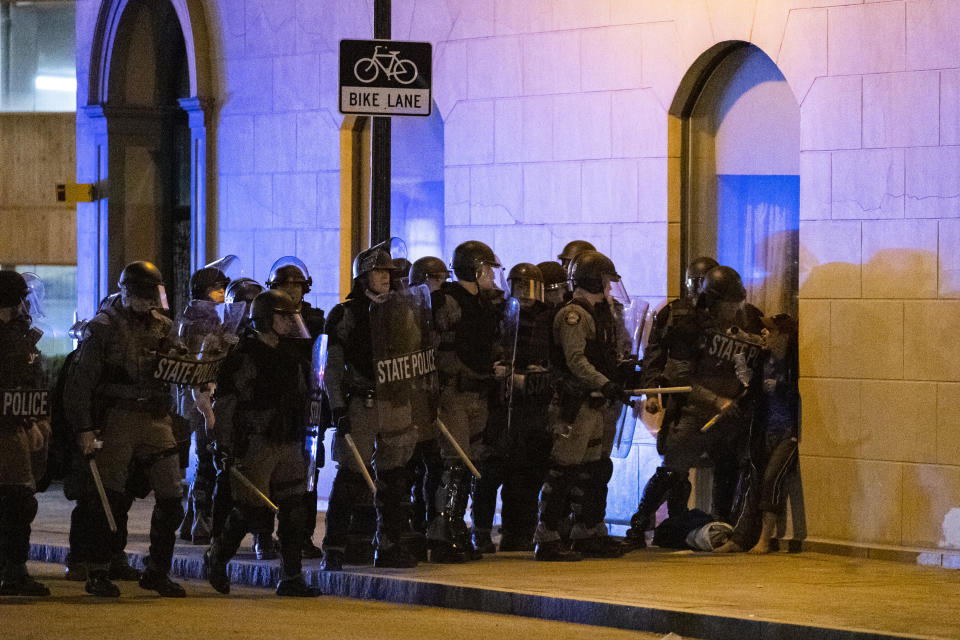 Police confront a woman (on the right) as they sought to clear a block during protests on Saturday in Louisville, Kentucky. Even before the May 25 police killing of a Black man in Minneapolis sparked nationwide protests, tensions already were high in Louisville due to the deadly police shooting in March of a Black woman. (Photo: Brett Carlsen via Getty Images)