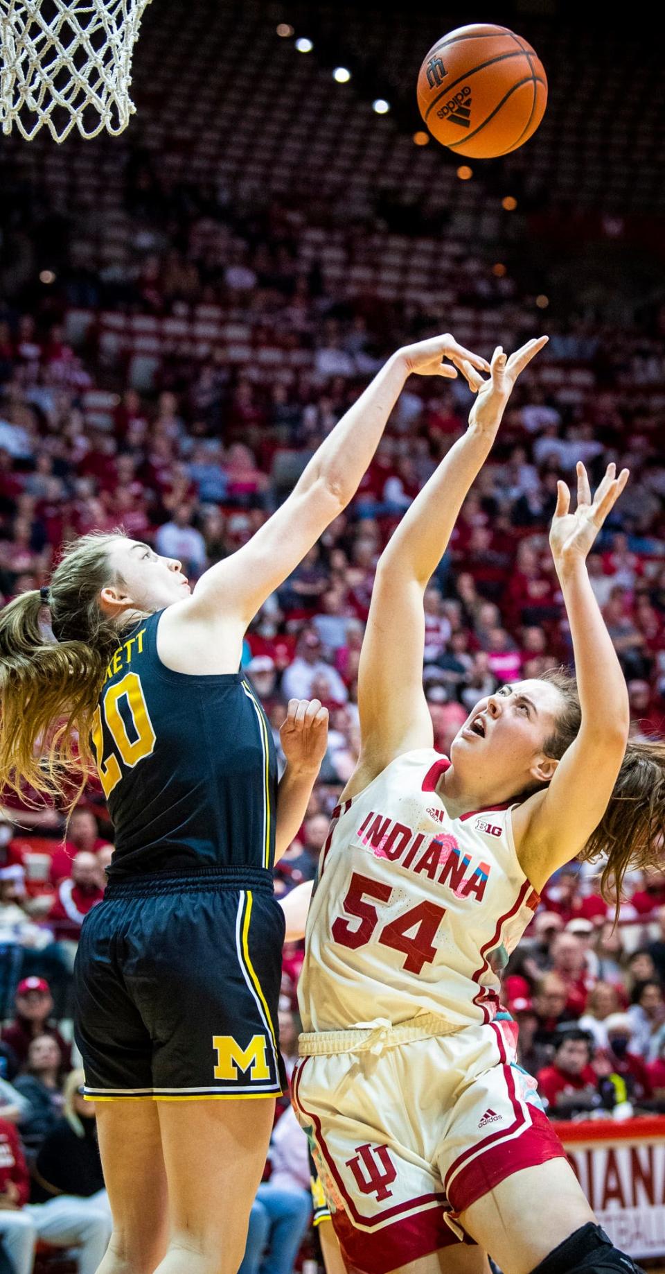 Indiana's Mackenzie Holmes (54) is blocked by Michigan's Alyssa Crockett (20) during the second half of the Indiana versus Michigan women's basketball game at Simon Skjodt Assembly Hall on Thursday, Feb. 16, 2023.