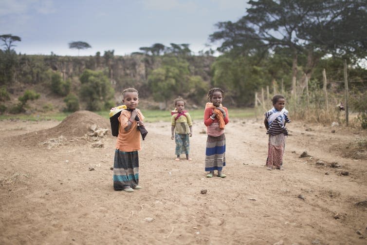 <span class="caption">Fetching water in Ethiopia, 2016.</span> <span class="attribution"><span class="source">Melih Cevdet Teksen/Shutterstock</span></span>