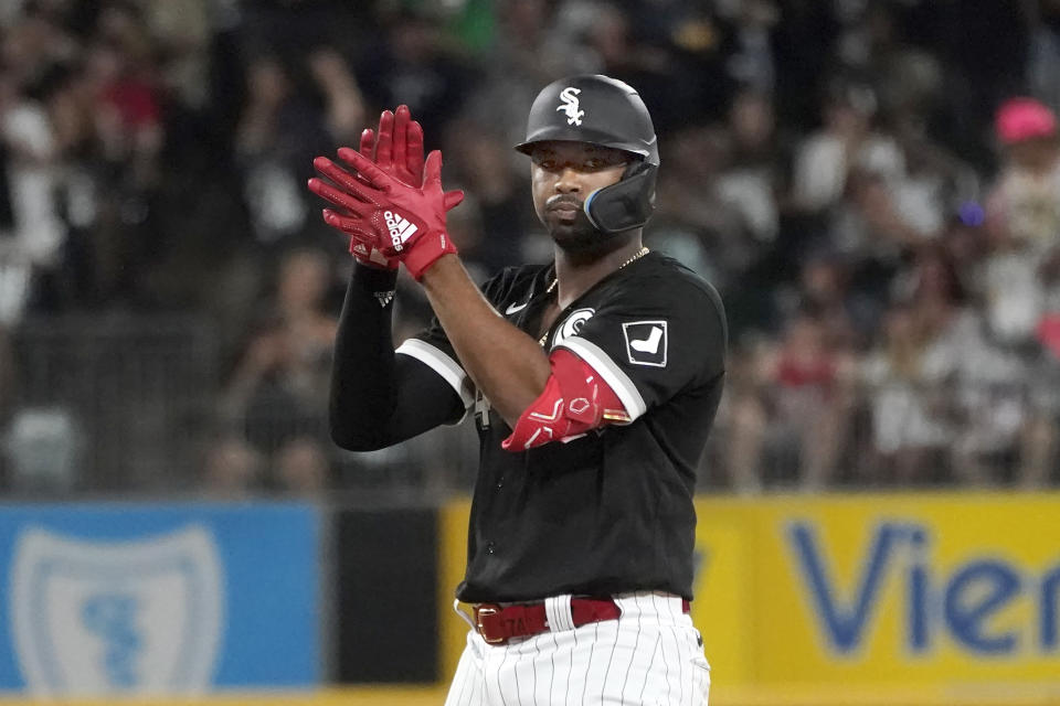Chicago White Sox's Eloy Jimenez celebrates his two-run double off Kansas City Royals starting pitcher Brad Keller, during the fourth inning of a baseball game Tuesday, Aug. 2, 2022, in Chicago. (AP Photo/Charles Rex Arbogast)