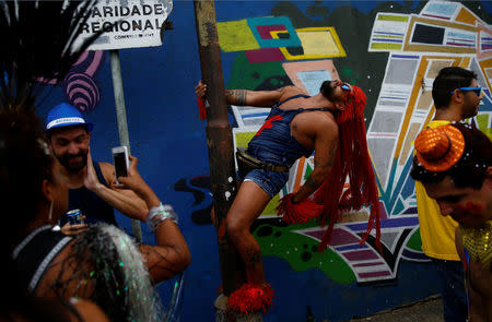 Revellers take part in an annual block party known as "Ceu na Terra" (Heaven on Earth), one of the many carnival parties to take place in the neighbourhoods of Rio de Janeiro, Brazil February 25, 2017. REUTERS/Ricardo Moraes