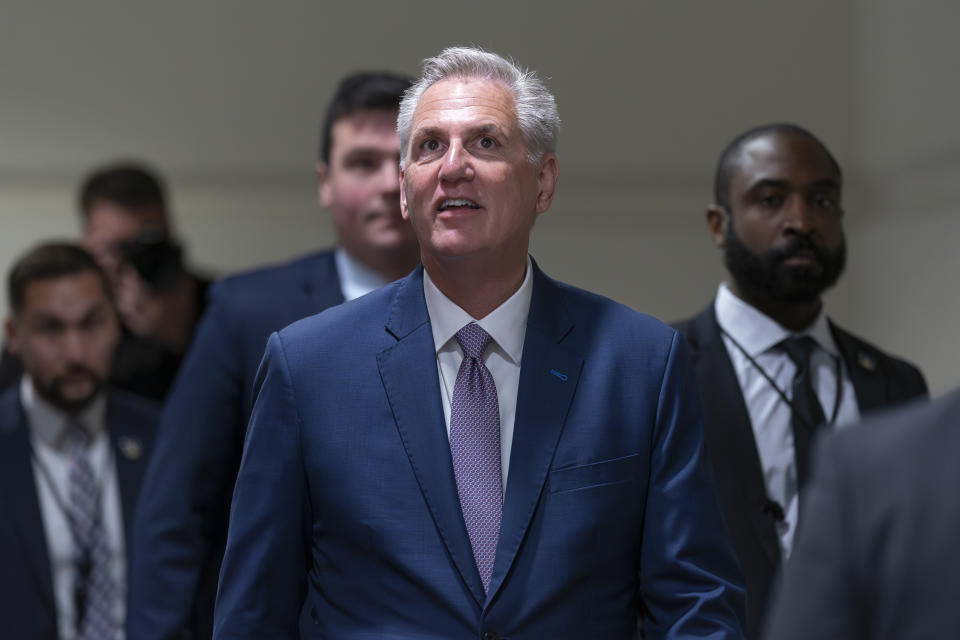 Speaker of the House Kevin McCarthy, R-Calif., arrives for a closed-door meeting with fellow Republicans as he pushes his sweeping debt ceiling package, at the Capitol in Washington, Wednesday, April 26, 2023. McCarthy is struggling to round up the votes for the bill, which would couple an increase of the country's debt ceiling with restrictions on federal spending. A final vote on the package is likely Thursday. (AP Photo/J. Scott Applewhite)