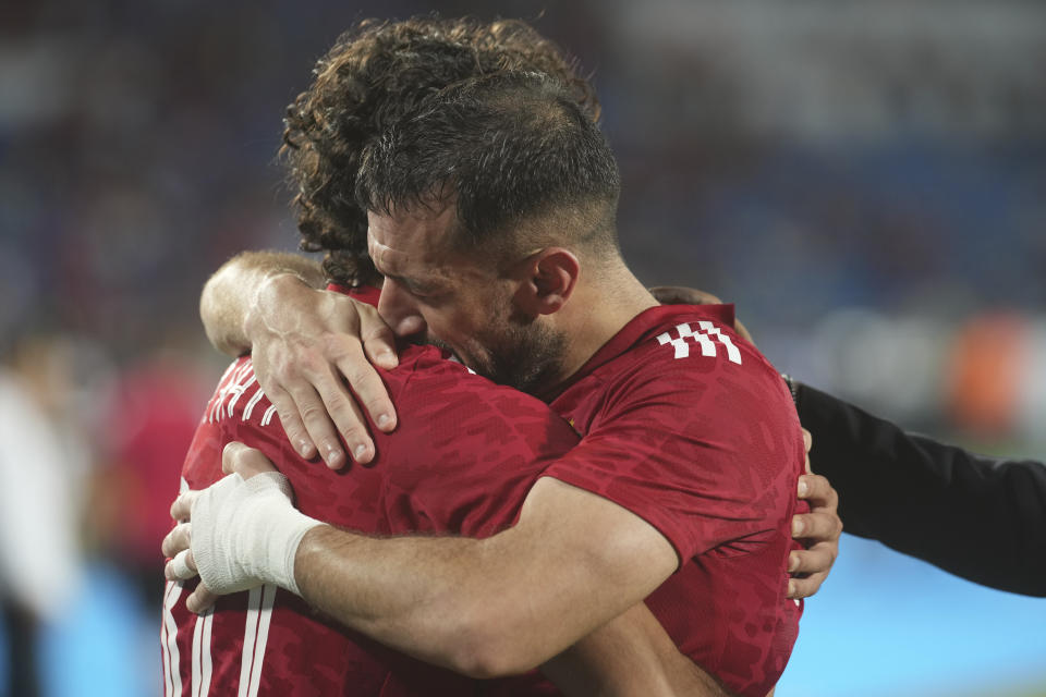 Al Ahly's Ali Maaloul and Al Ahly's Mohamed Hany celebrate after winning the CAF Champions League final soccer match between Morocco's Wydad Athletic Club and Egypt's Al Ahly SC, at the Mohammed V stadium, in Casablanca, Morocco, Sunday, June 11, 2023. (AP Photo/Mosa'ab Elshamy)