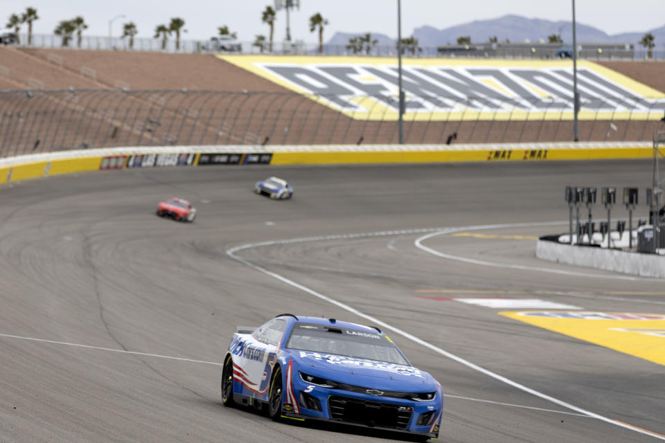 Kyle Larson (5) rounds the track during a NASCAR Cup Series auto race on Sunday, March 5, 2023, in Las Vegas. (AP Photo/Ellen Schmidt)