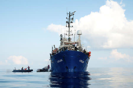 Migrants are seen on the deck of the Mission Lifeline rescue boat in the central Mediterranean Sea, June 21, 2018. Picture taken June 21, 2018. Hermine Poschmann/Misson-Lifeline/Handout via REUTERS