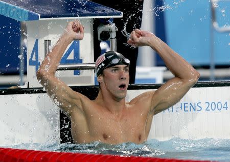 Athens: 100m butterfly. REUTERS/Jerry Lampen