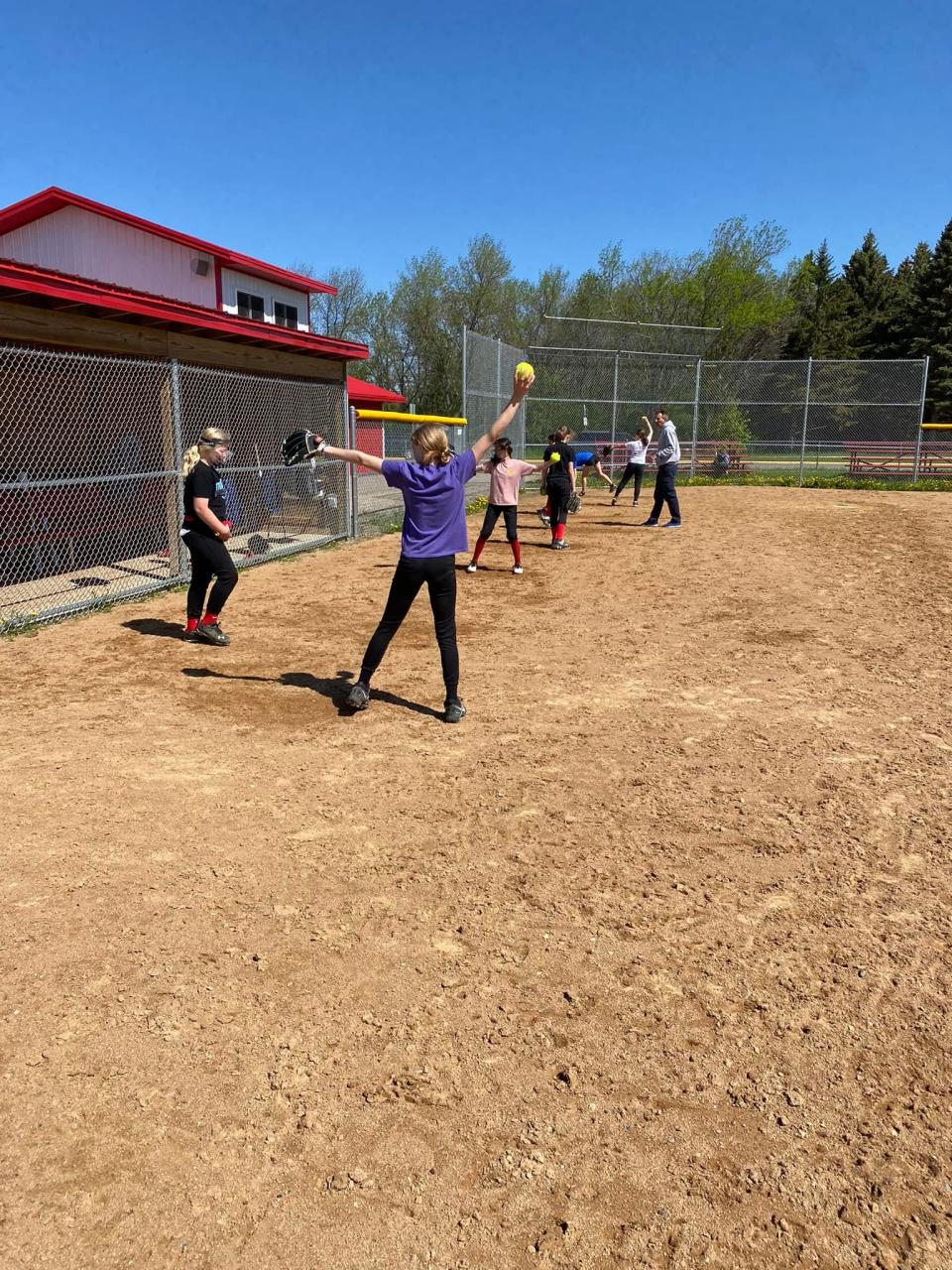 Devils Lake Youth Fastpitch practices on the field.