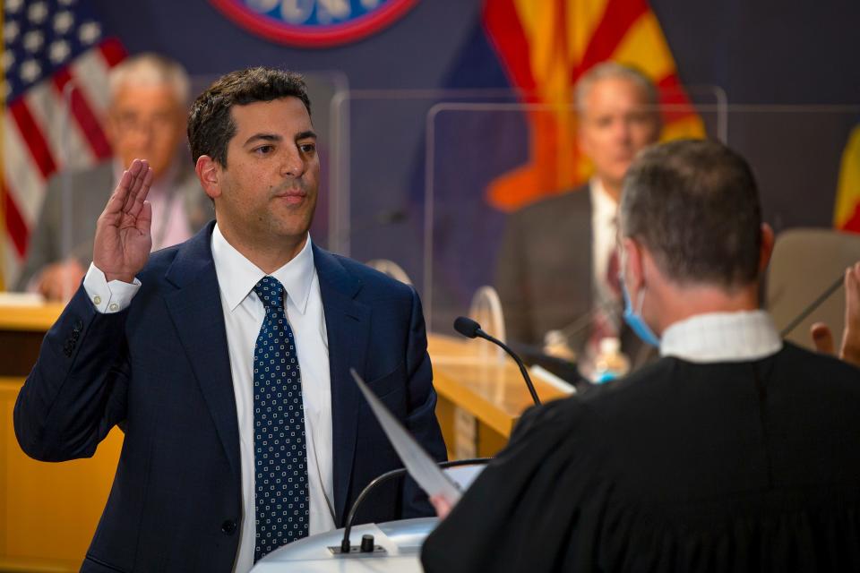 Thomas Galvin is sworn in by a judge as the newest supervisor for the Maricopa County Board of Supervisors in Phoenix on Dec. 8, 2021.