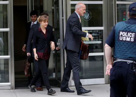 Actor Allison Mack, known for her role in the TV series 'Smallville', exits with her lawyers following a hearing on charges of sex trafficking in relation to the Albany-based organization Nxivm at United States Federal Courthouse in Brooklyn, New York, U.S., May 4, 2018. REUTERS/Brendan McDermid