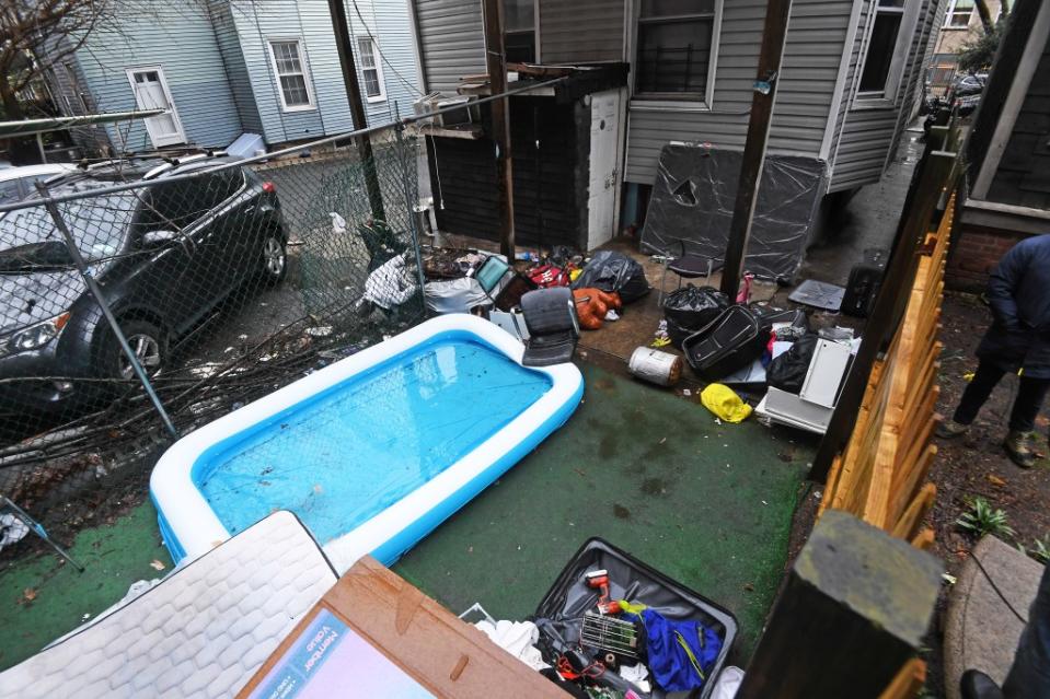 Debris litters the backyard of the Bronx home. Matthew McDermott