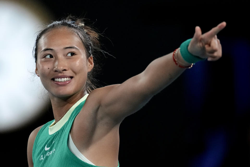 Zheng Qinwen of China waves after defeating Anna Kalinskaya of Russia in their quarterfinal match at the Australian Open tennis championships at Melbourne Park, Melbourne, Australia, Wednesday, Jan. 24, 2024. (AP Photo/Louise Delmotte)