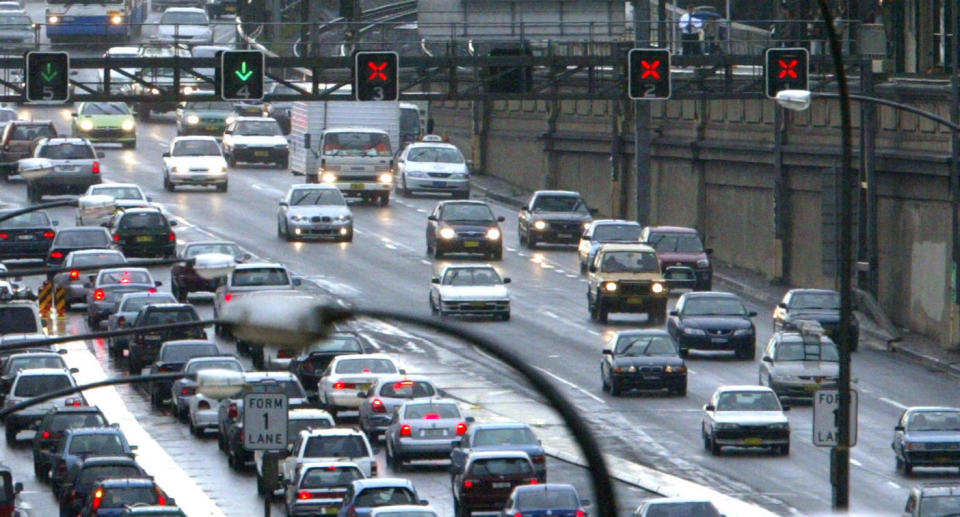 Cars cross the Sydney Harbour bridge headed to North Sydney.