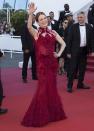 <p>The redhead broke with style conventions and matched her hair to her custom Givenchy gown. (Photo: AP) </p>