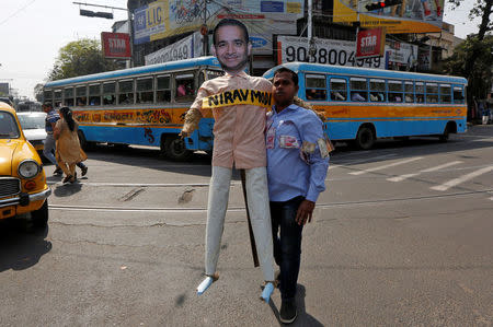 A demonstrator holds an effigy depicting billionaire jeweller Nirav Modi during a protest in Kolkata, India, February 18, 2018. REUTERS/Rupak De Chowdhuri