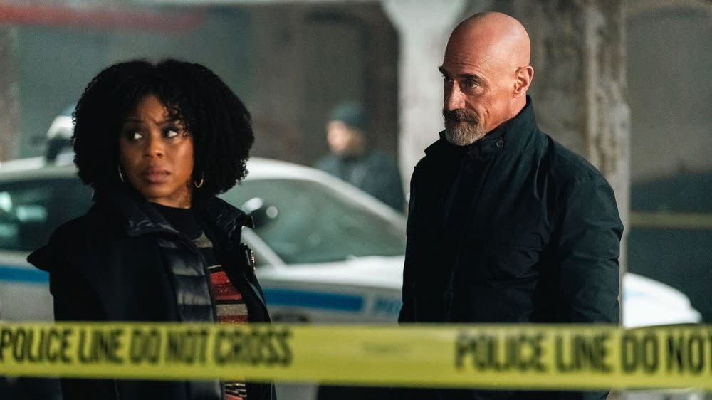  Danielle Moné Truitt as Sgt. Ayanna Bell and Christopher Meloni as Det. Elliot Stabler at a crime scene in Law & Order: Organized Crime season 4. 