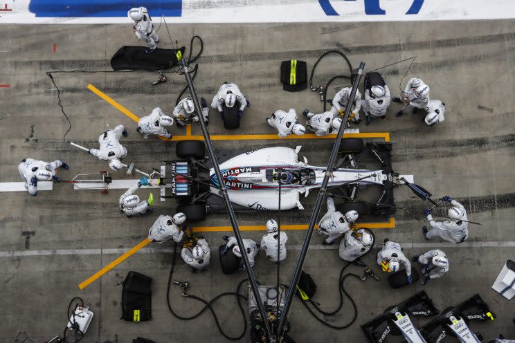 The Williams F1 pit crew get to work on Felipe Massa's car