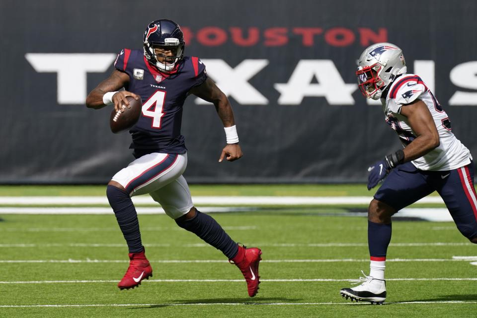 Houston Texans quarterback Deshaun Watson (4) runs past New England Patriots linebacker Josh Uche (53) during the first half of an NFL football game, Sunday, Nov. 22, 2020, in Houston. (AP Photo/David J. Phillip)