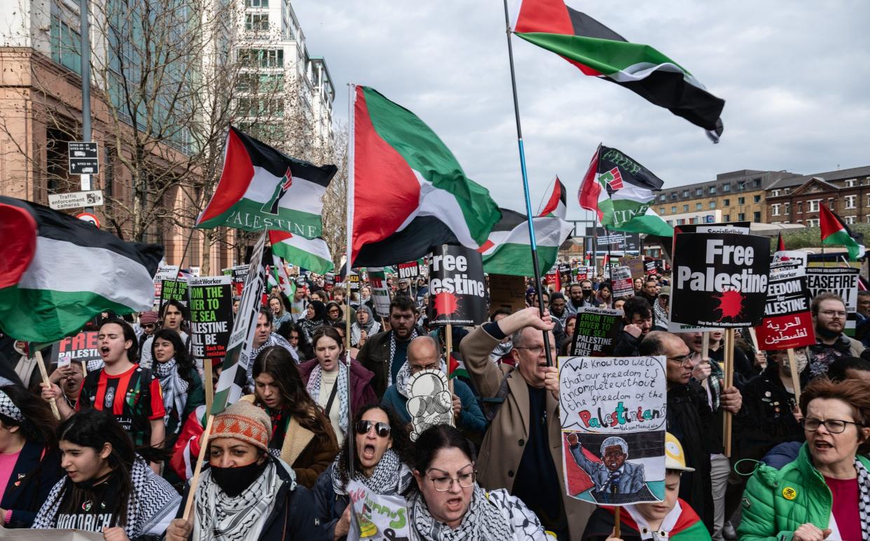 Protesters attend a march, demanding a ceasefire in Gaza