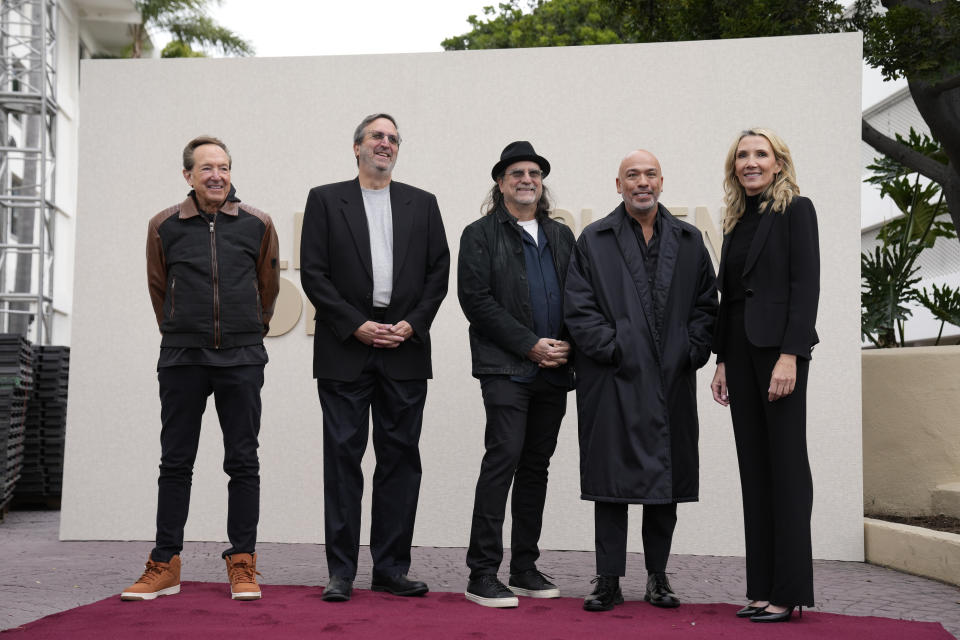 From left, Barry Adelman, Ricky Kirshner, Glenn Weiss, Jo Koy, and Helen Hoehne stand on the red carpet during the Golden Globe Awards Press Preview at the Beverly Hilton, Thursday, Jan. 4, 2024, in Beverly Hills, Calif. (AP Photo/Ashley Landis)