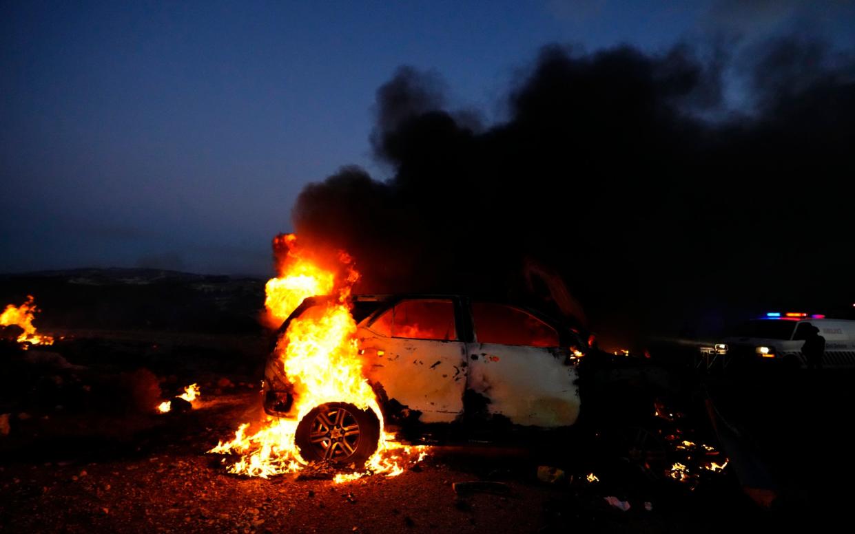 Journalists' car burns after it was hit by Israeli shelling