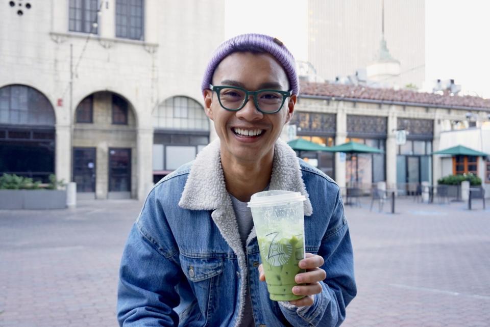 Author holding Starbucks drink