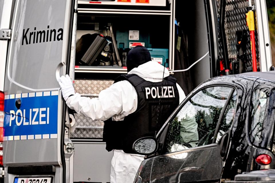 A police officer works during a raid in Berlin (EPA)