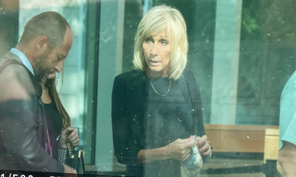 Mayor Shaunna O'Connell goes through the metal detector on her way into Taunton District Court Monday, July 22, 2024, for her arraignment.