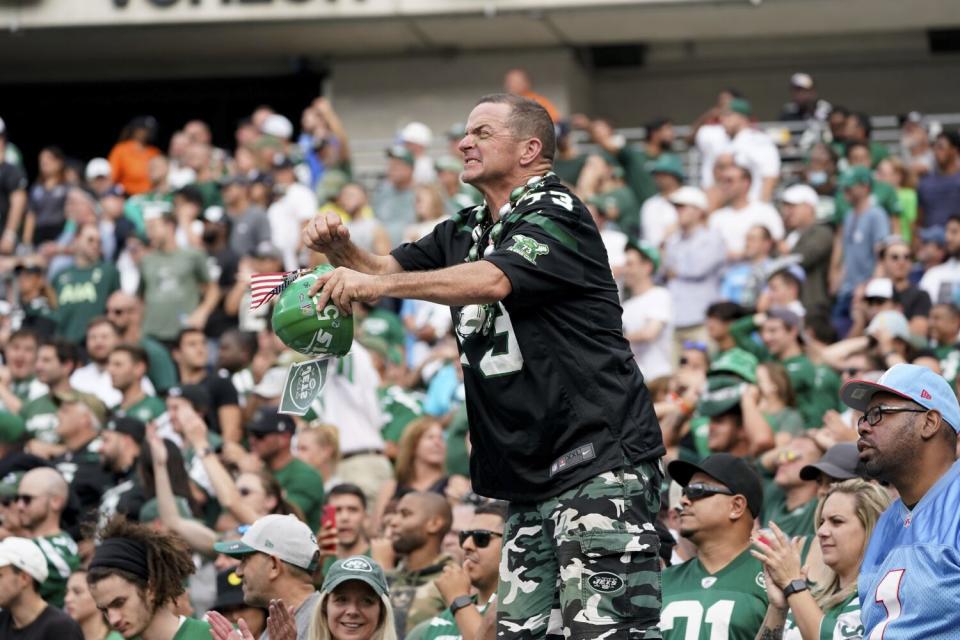 A New York Jets fan reacts during an NFL football game against the Tennessee Titans