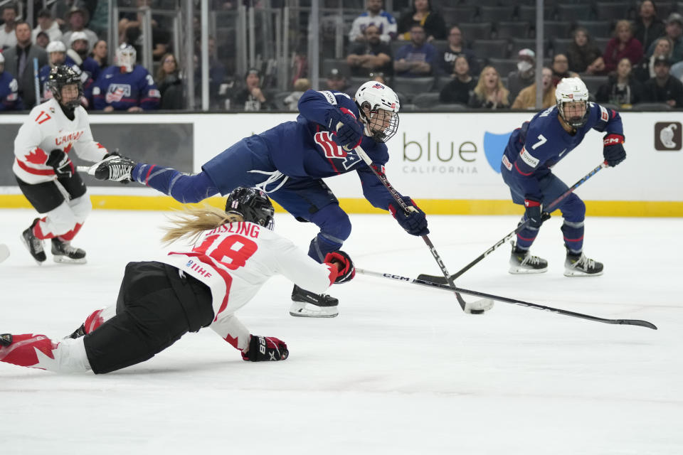 United States forward Britta Curl (17) shoots and scores against Canada forward Julia Gosling (88) during the second period of a rivalry series women's hockey game Saturday, Nov. 11, 2023, in Los Angeles. (AP Photo/Ashley Landis)