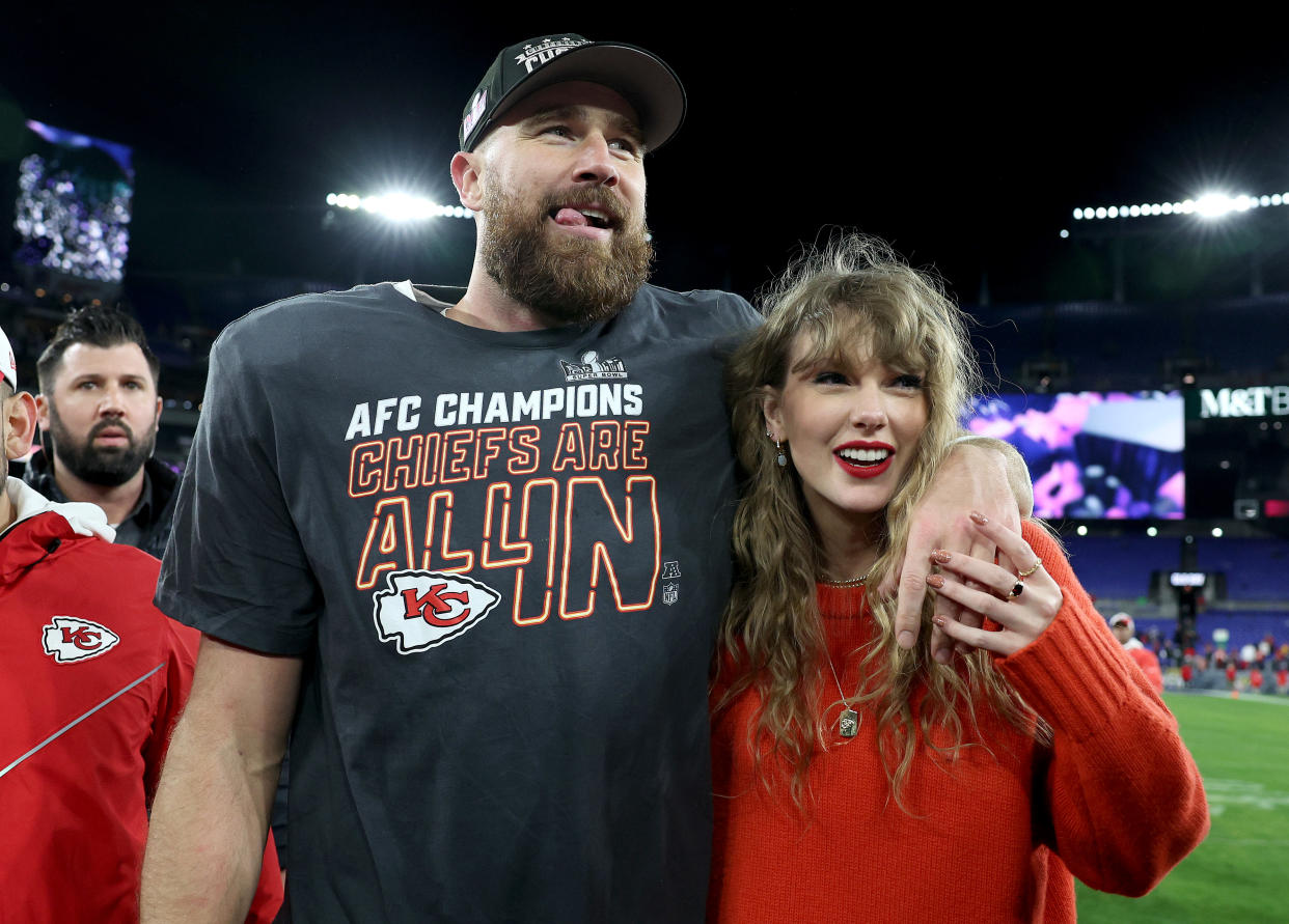 Travis Kelce of the Kansas City Chiefs celebrates with Taylor Swift after the Chiefs' 17-10 victory against the Baltimore Ravens in the AFC championship game. (Photo by Patrick Smith/Getty Images)