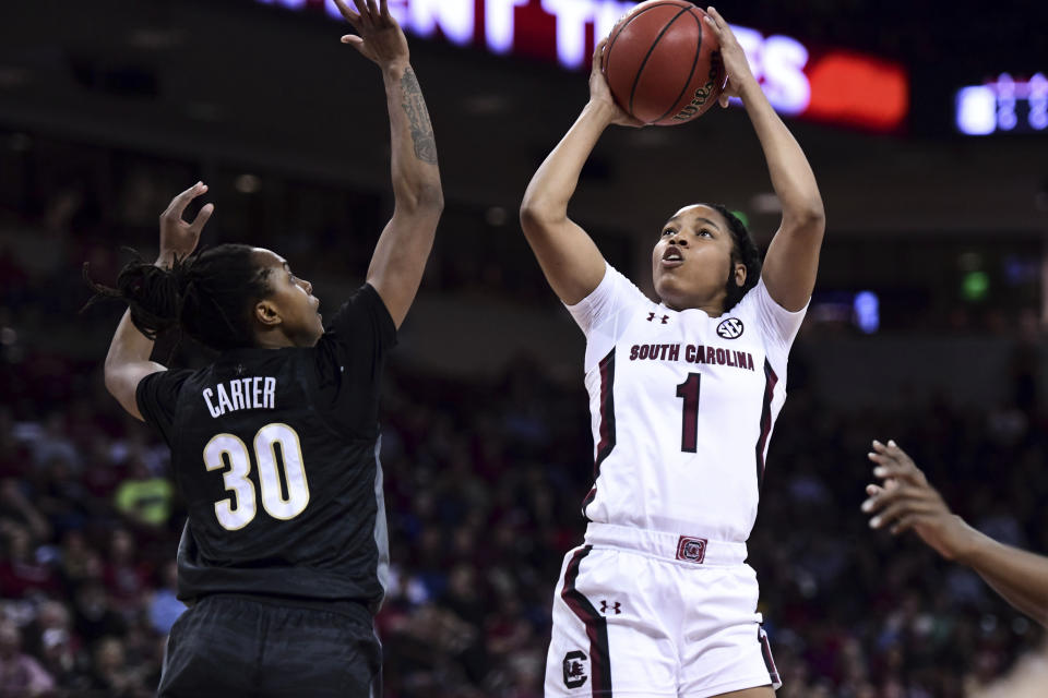 South Carolina guard Zia Cooke (1) attempts a shot against Vanderbilt guard Lea Lea Carter (30) during the first half of an NCAA college basketball game Monday, Feb. 17, 2020, in Columbia, S.C. (AP Photo/Sean Rayford)