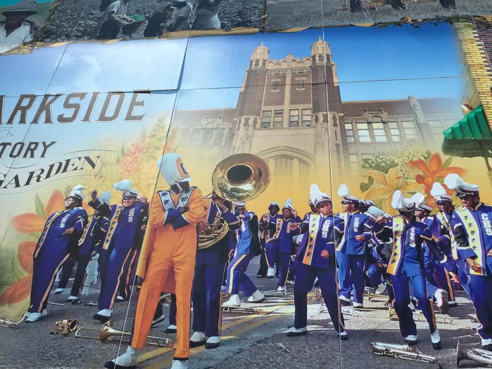 The mural pays tribute to Camden High, the Castle on the Hill, and its Mighty Panthers Marching Band, as well as famous Parkside eateries Donkey's Place and Corinne's Place.