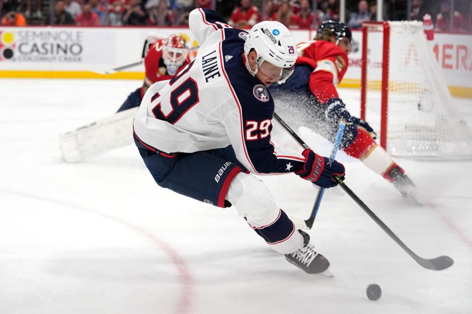 Columbus Blue Jackets left wing Patrik Laine (29) skates with the puck during the first period of an NHL hockey game against the Florida Panthers, Tuesday, Dec. 13, 2022, in Sunrise, Fla. (AP Photo/Lynne Sladky)